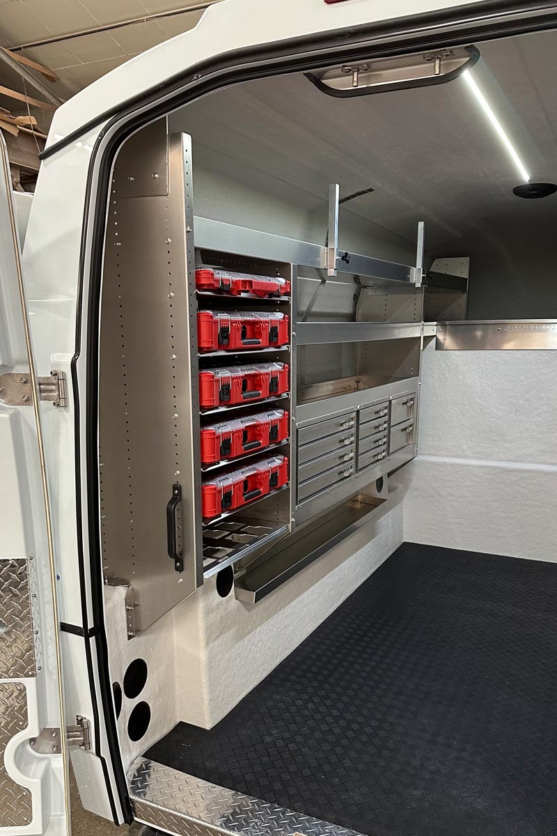m75-mil-packout Interior storage with long-material rack and Milwaukee PACKOUT organization